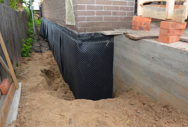 Happy homeowners after waterproofing job in Stroh